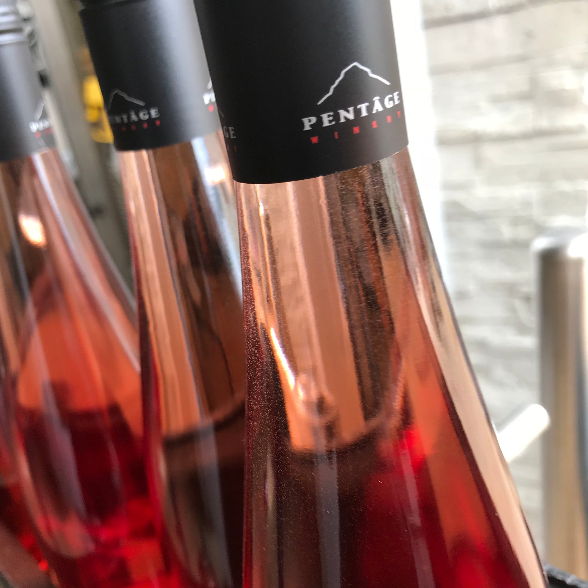 Rose bottles at Pentâge Winery