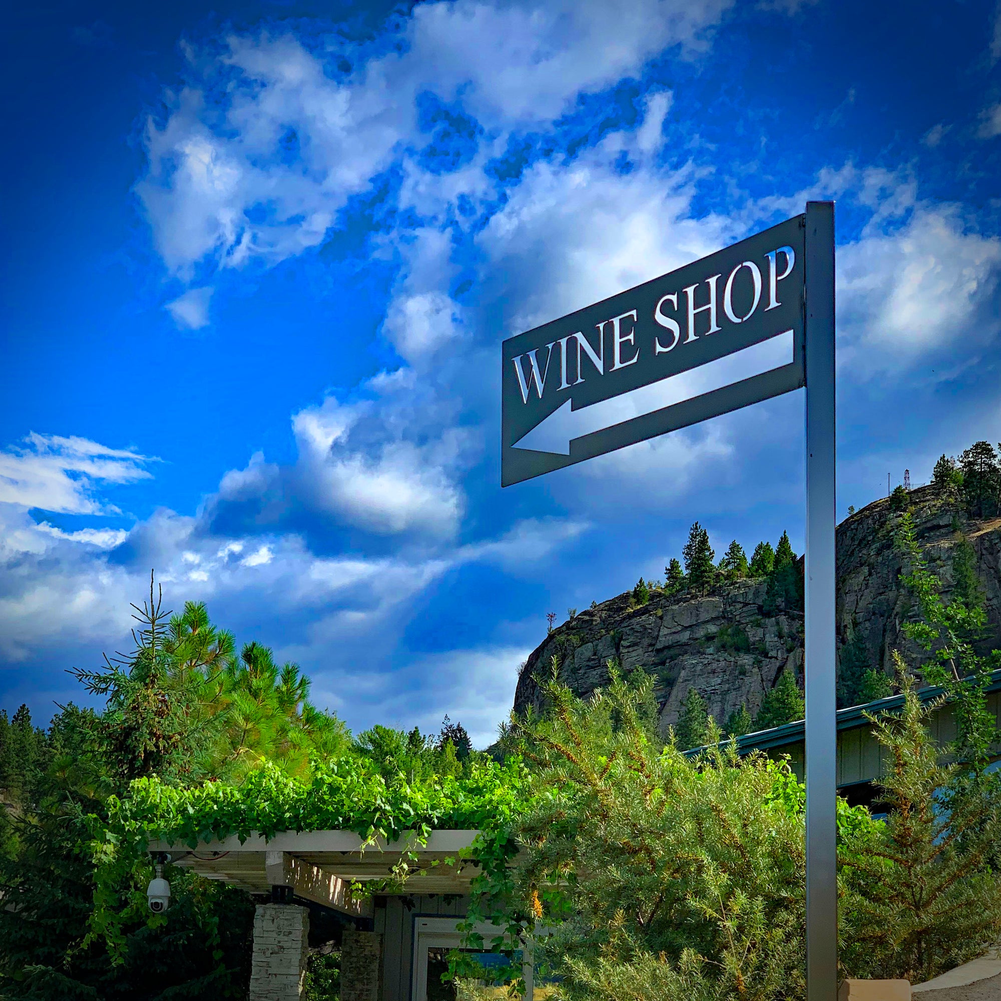 Sign showing you where to go for a wine tasting at Pentâge Winery in the Okanagan Valley.