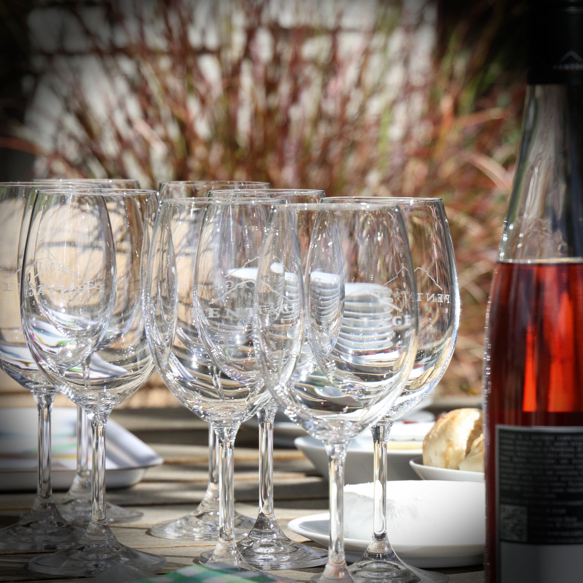 Wine glasses and a bottle of Rosé on a lunch table | Pentâge Winery